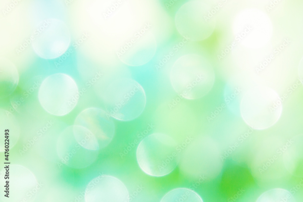 Defocused lights on a bright green and blue background. Defocused lights on a bright green and blue background.