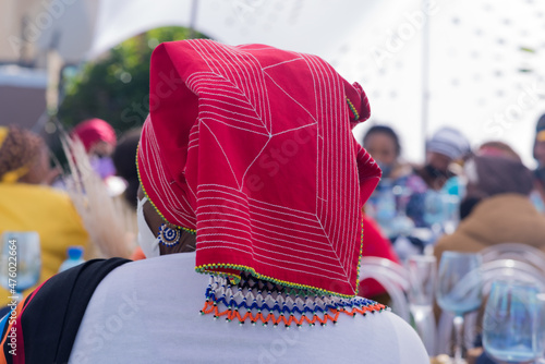 African woman with headgear shot from behind photo