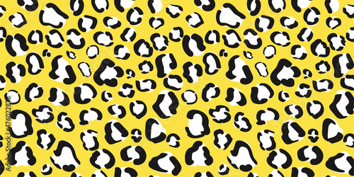 Yellow leopard print seamless pattern. Cheetah animal skin background. Wrapping paper or fabric design