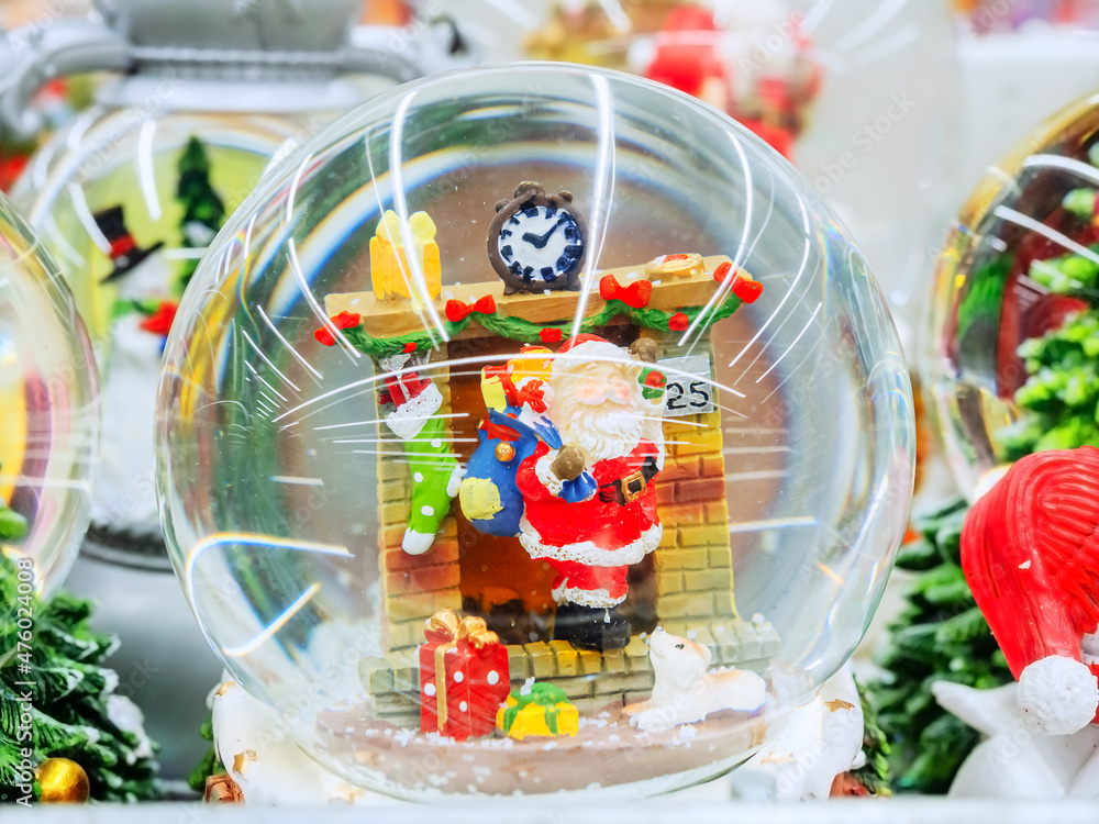 Transparent decorative christmas ball with santa inside it