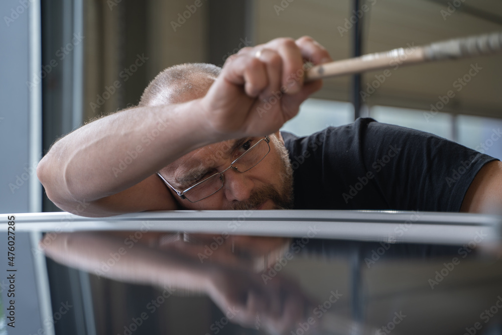 Process of Repairing Dents On Car Body. Technician Is Working Using