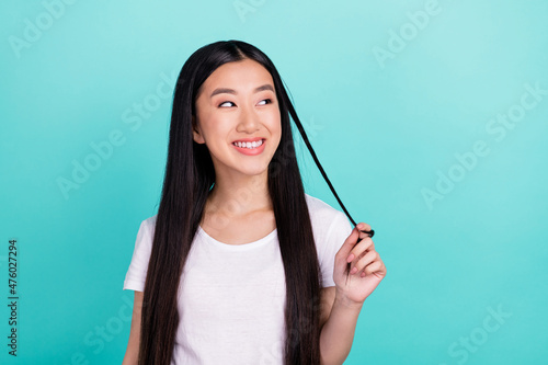 Portrait of attractive cheerful curious cheery long-haired girl thinking isolated over bright teal turquoise color background