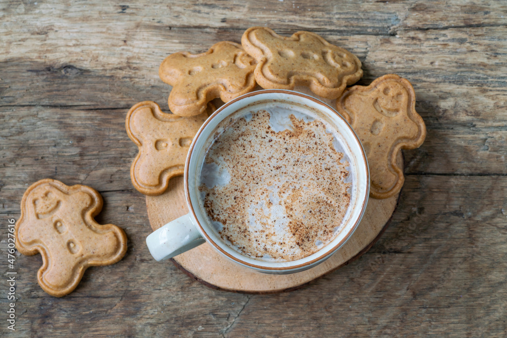 gingerbread cookies and coffee on wooden table for christmas gingerbread cookies and coffee on wooden table for christmas