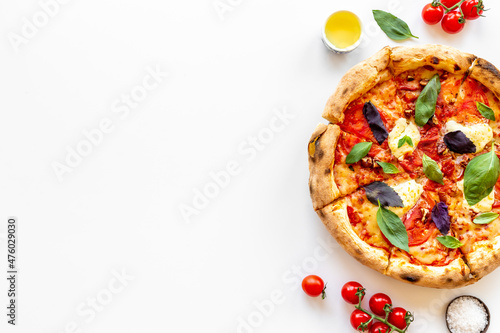 Food ingredients for cooking pizza - tomatoes cheese and basil