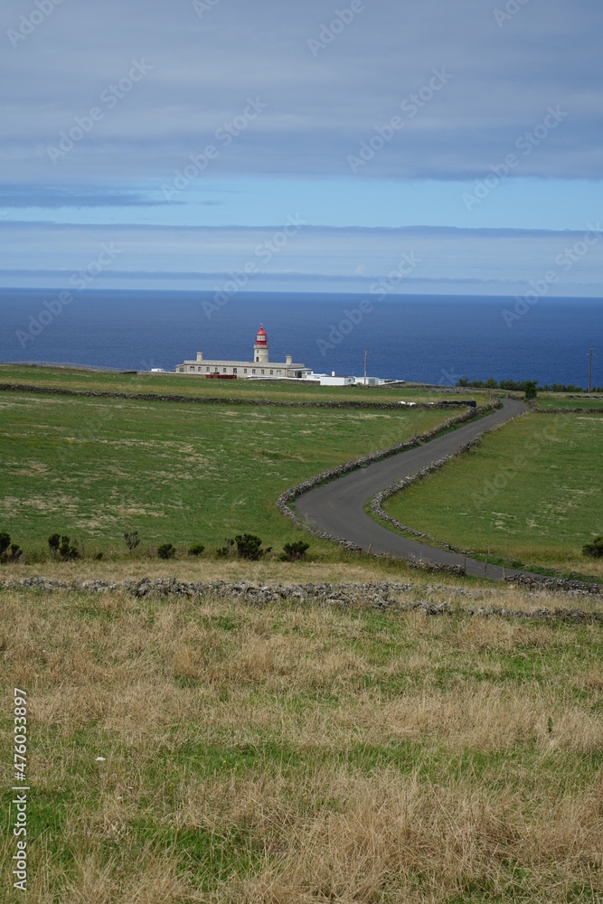 Scenic view on Farol do Albarnaz Lighthouse and the endless Atlantic Ocean (horizontal image), Ponta Delgada, Flores, Azores, Portugal