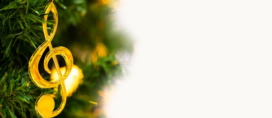 Christmas tree with note melody song decoration.banner background.Caroling or Carolers singing.group singing carol song on celebration of christmas day in winter time.Church, music, choir.Concert.
