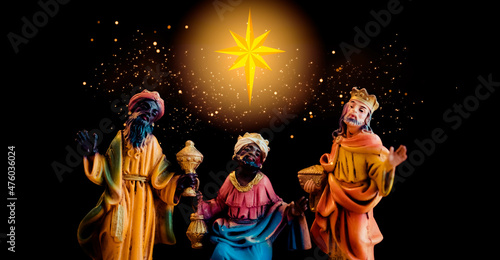 Fotografiet Christmas nativity scene of Three wise men follow the Star for worship Jesus Christ new born king in the manger