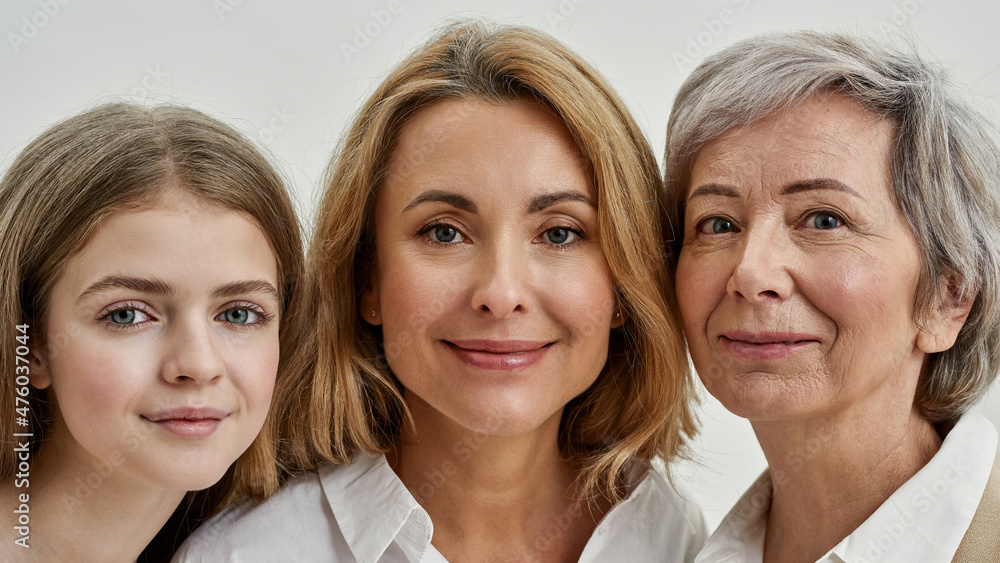 Close up of smiling three females look at camera Close up of smiling three females look at camera