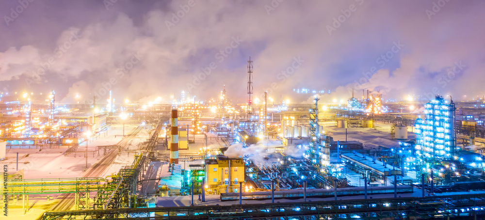 Aerial drone view of petrol industrial zone or oil refinery in Yaroslavl, Russia during winter at night.