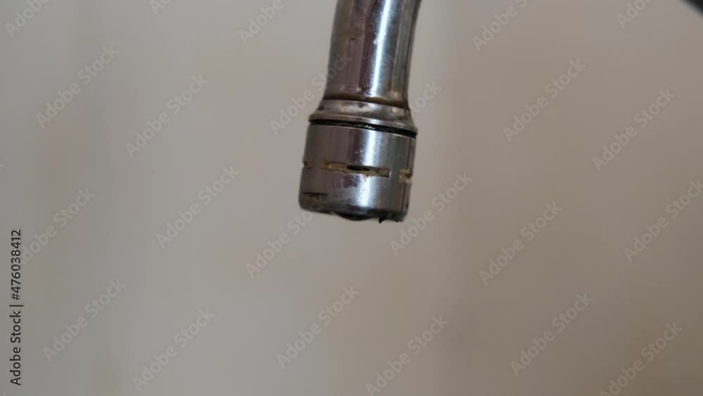 Dripping tap water. Faulty valve gasket, flow rate, water saving concept. Dripping tap water. Faulty valve gasket, flow rate, water saving concept.