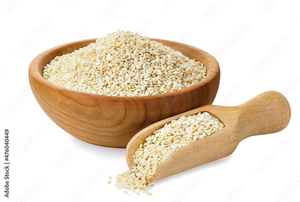 sesame seeds in wooden bowl and scoop isolated sesame seeds in wooden bowl and scoop isolated