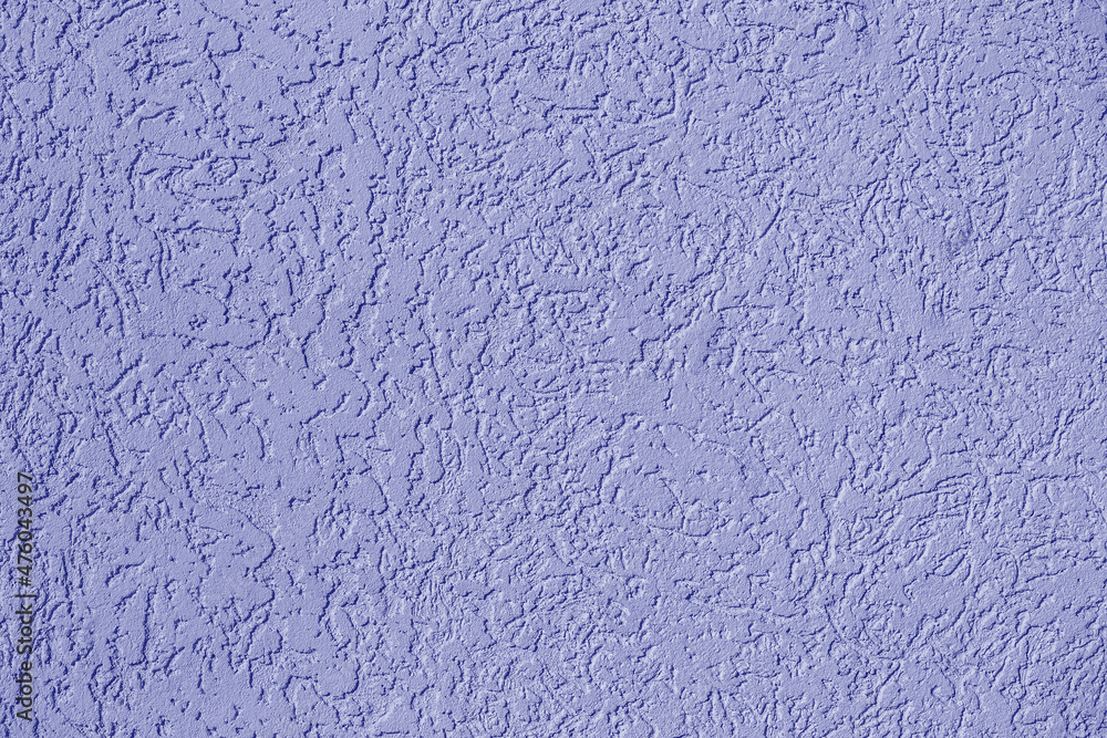 Rough stucco wall texture, wall background toned in trendy color of the year 2022 . Ultra Violet creative and moody color of the picture Rough stucco wall texture, wall background toned in trendy color of the year 2022 . Ultra Violet creative and moody color of the picture