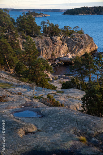 Beautiful natural Scandinavian landscape. Rocky shore at the Baltic sea with pine trees forest. Sunny late autumn or winter day in the nature in Sweden, Stockholm archipelago. © boumenjapet