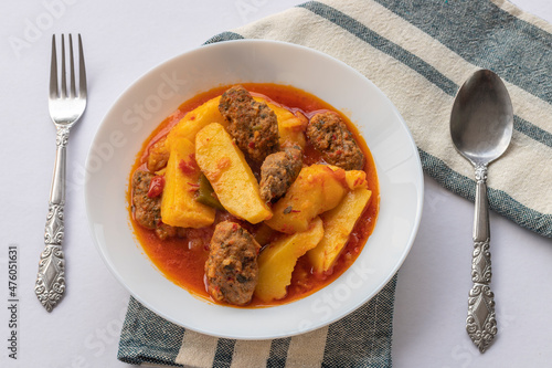 Traditional Homemade Turkish Food Kofte - Kofta with Tomato Sauce and Potatoes. (Turkish name; Izmir kofte) photo