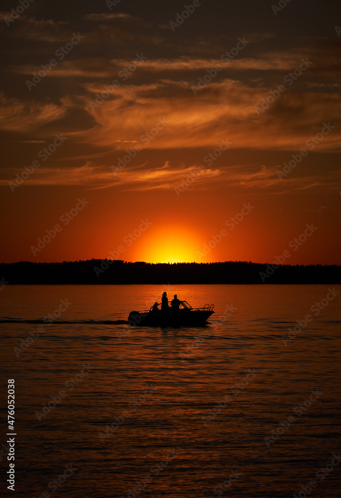 Silhouette Passenger Motor Boat Sailing at Sunset