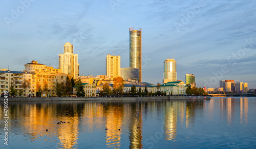 High-rise buildings in the golden hour on the lake shore.