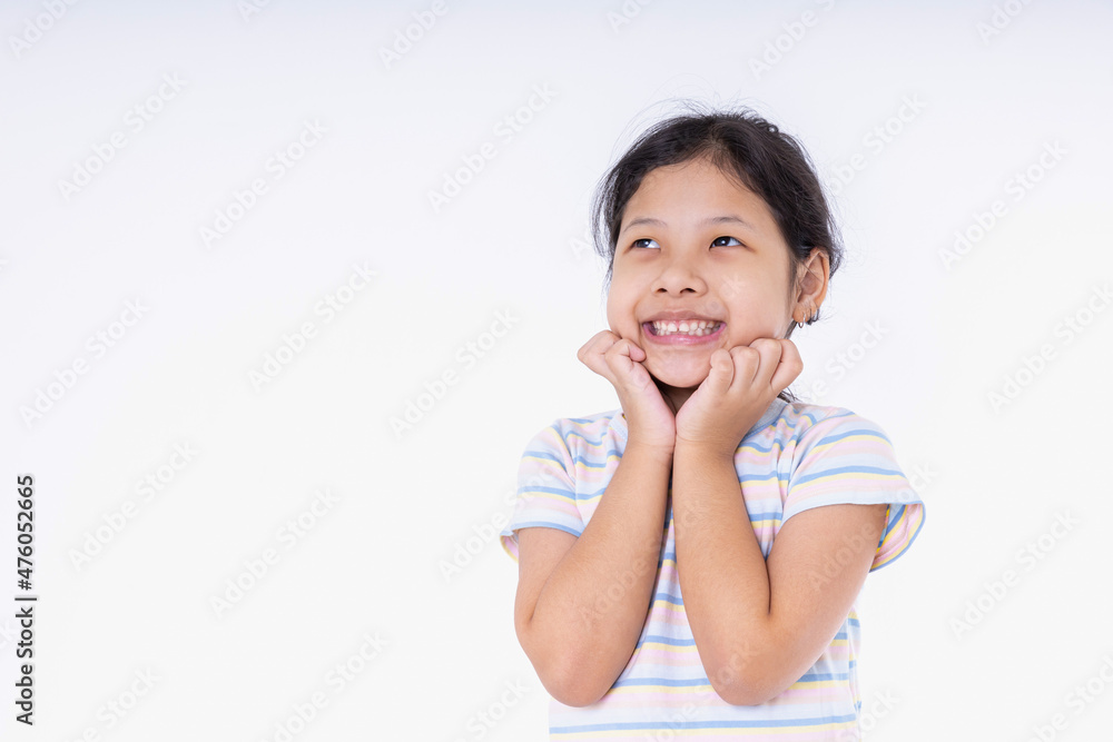 Portrait Asian kid girls are very cute smiles very happy, cheerful, bright, positive attitude. Photography standing in a studio with white background and copy space. Portrait Asian kid girls are very cute smiles very happy, cheerful, bright, positive attitude. Photography standing in a studio with white background and copy space.
