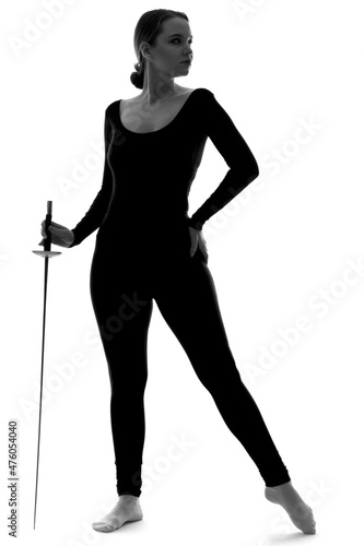 Silhouette of a young woman in full height with a sword in her hand on an isolated background.