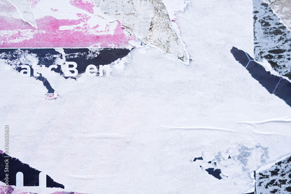 rough texture of the ripped poster. creative abstract art of the removed placard paper. a street material for texture background element. rough texture of the ripped poster. creative abstract art of the removed placard paper. a street material for texture background element.