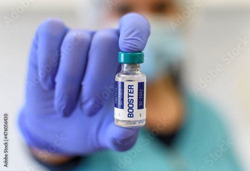 Fotografija Close-up selective focus photo of medical worker holding covid vaccine vial with
