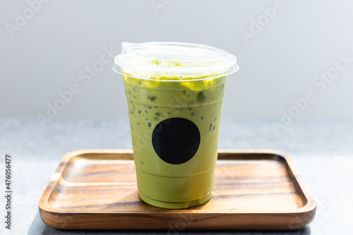 Green tea latte in plastic cup.