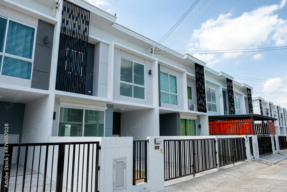 Village project for sale of modern white townhouse 2 floors with fence in Bang Yai
