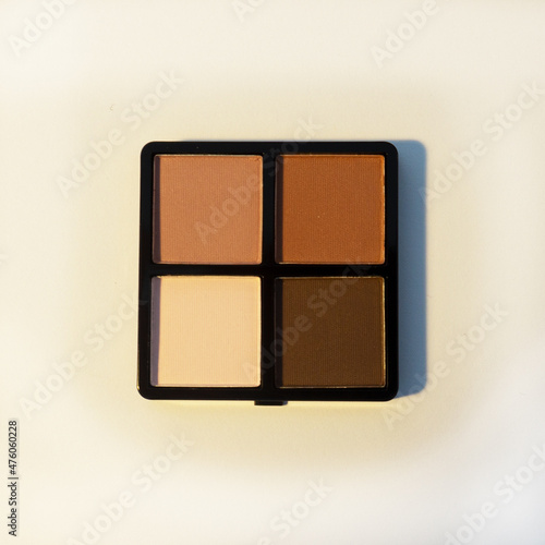 Palette. Eyebrow shadow. Eyebrow cosmetic designed to fill in sparse, light, or overly tweezed or plucked eyebrows.