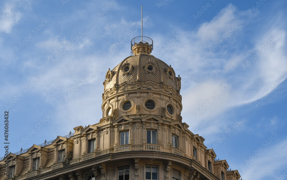 Top of the Palazzo del Credito Italiano (1914) in Piazza De Ferrari square against blue sky, Genoa, Liguria, Italy