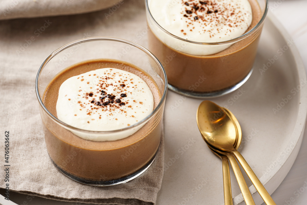 Italian chocolate and coffee mousse dessert semifreddo - half-frozen ice cream with whipped cream and cocoa powder in small glasses Italian chocolate and coffee mousse dessert semifreddo - half-frozen ice cream with whipped cream and cocoa powder in small glasses