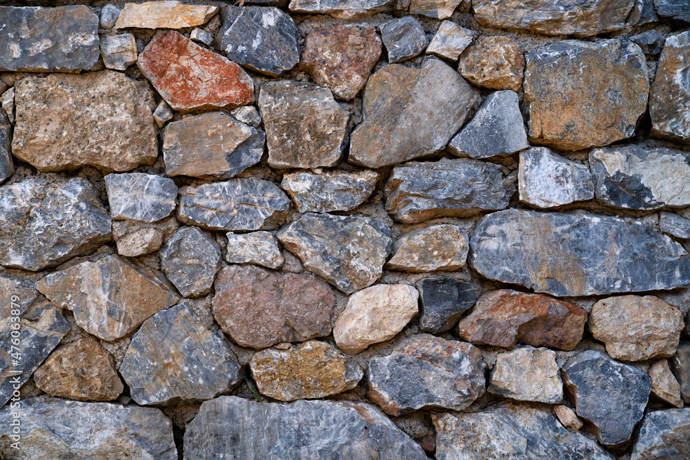 Background texture of masonry wall made of natural multicolored stones. Background texture of masonry wall made of natural multicolored stones.