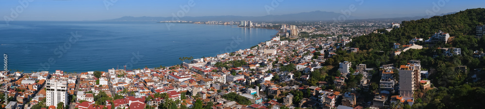 Aerial panoramic view of Puerta Vallarta town and Bay of Banderas, sunny day, blue sky. Travel, vacation, sightseeing concept.