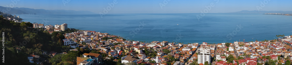 Aerial panoramic view of Puerta Vallarta town and Bay of Banderas, sunny day, blue sky. Travel, vacation, sightseeing concept.