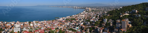 Aerial panoramic view of Puerta Vallarta town and Bay of Banderas, sunny day, blue sky. Travel, vacation, sightseeing concept. © Elena Berd