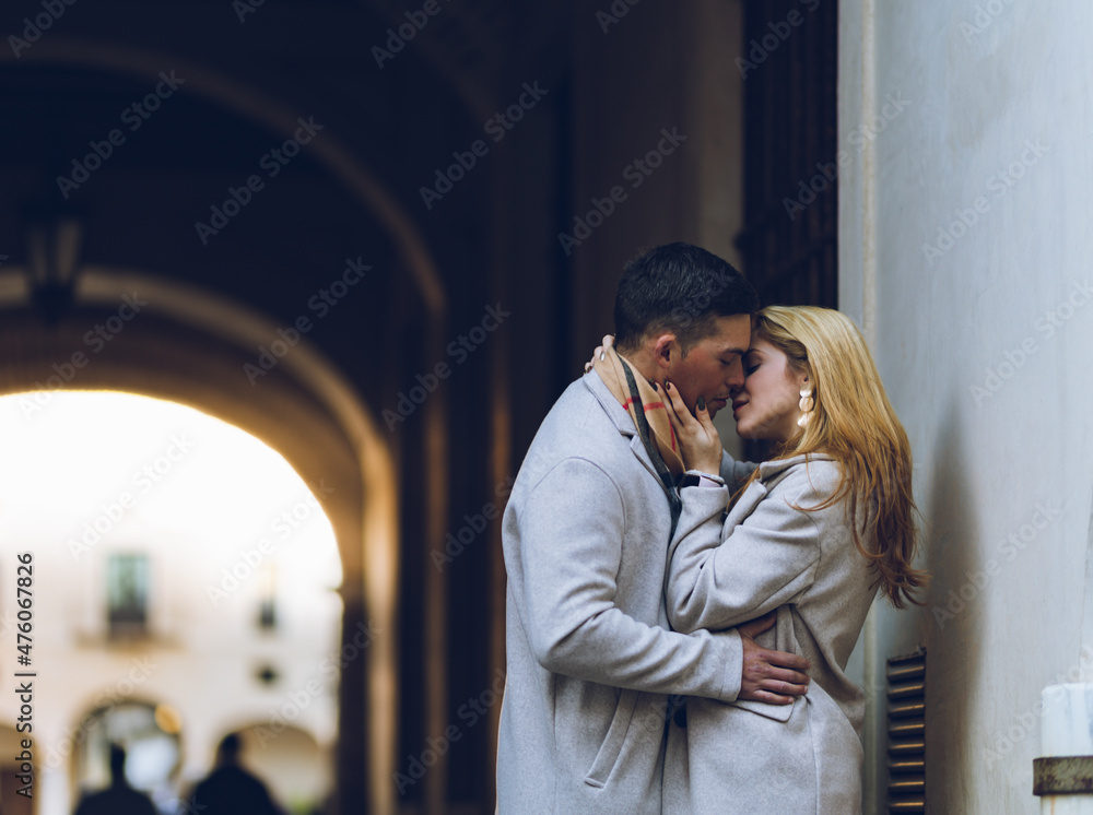 Young couple in love kissing on the street Young couple in love kissing on the street