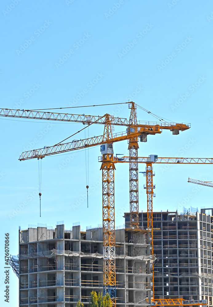 Crane and highrise construction site Crane and highrise construction site