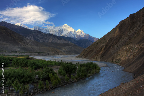 Early morning in Kali-Gandaki valley beneath snow-covered peaks of Annapurna North mountain