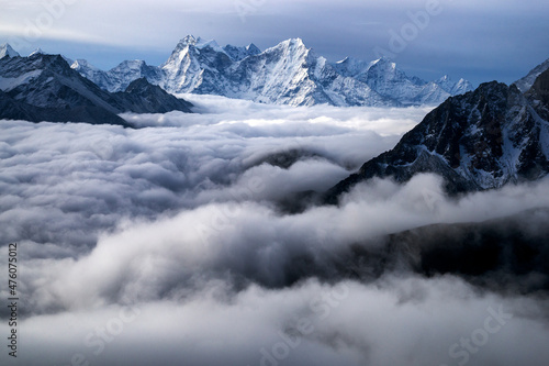 Nepal  Himalayas  sunrise view from Gokio Ri peak at cloud sea over Gokio valley and mountains Tamserku and Kangtega. 