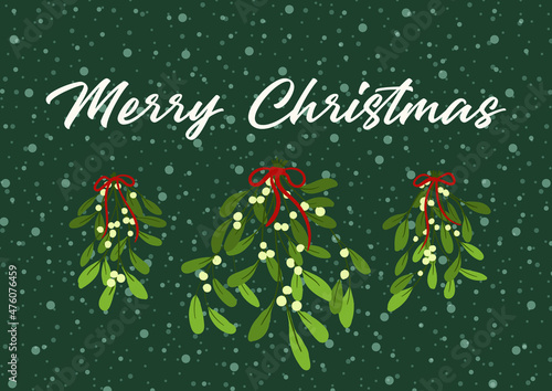 Christmas card with mistletoe and congratulation on green background 