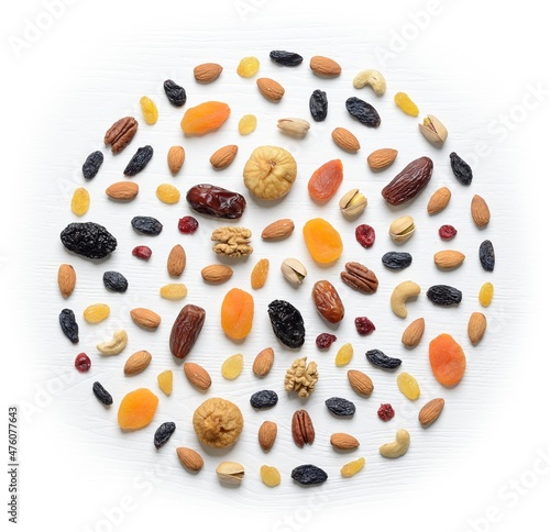 Mix of dried fruits and nuts - symbols of judaic holiday Tu Bishvat.Round leather fruit background