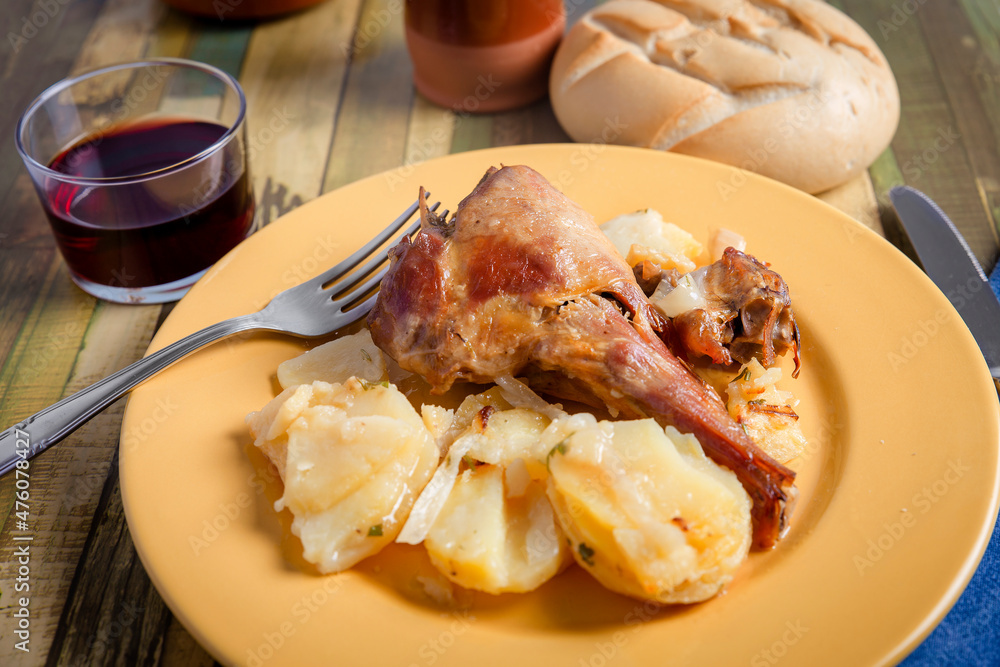 dish with oven roasted lamb with potatoes. traditional Christmas food dish with oven roasted lamb with potatoes. traditional Christmas food
