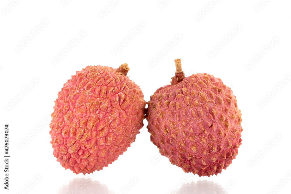 Two ripe organic litchi fruit, close-up, isolated on white. Two ripe organic litchi fruit, close-up, isolated on white.