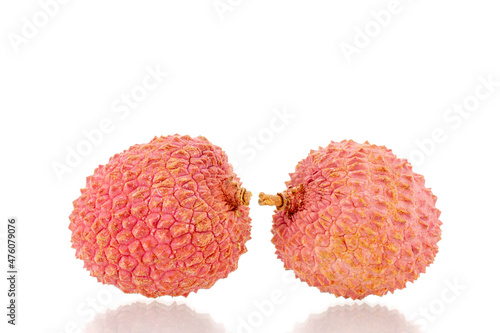 Two ripe organic litchi fruit, close-up, isolated on white.