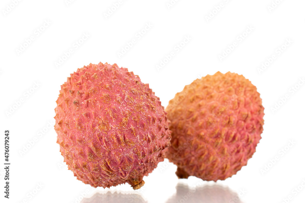 Two ripe organic litchi fruit, close-up, isolated on white. Two ripe organic litchi fruit, close-up, isolated on white.