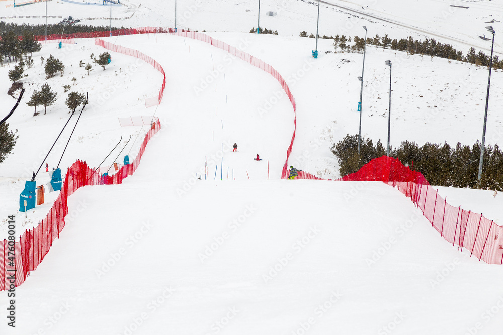 snowboarder is jumping with snowboard from snowhill. Skier skiing downhill in high mountains. Flying skier on mountains, winter extreme sport. snowboarder is jumping with snowboard from snowhill. Skier skiing downhill in high mountains. Flying skier on mountains, winter extreme sport.