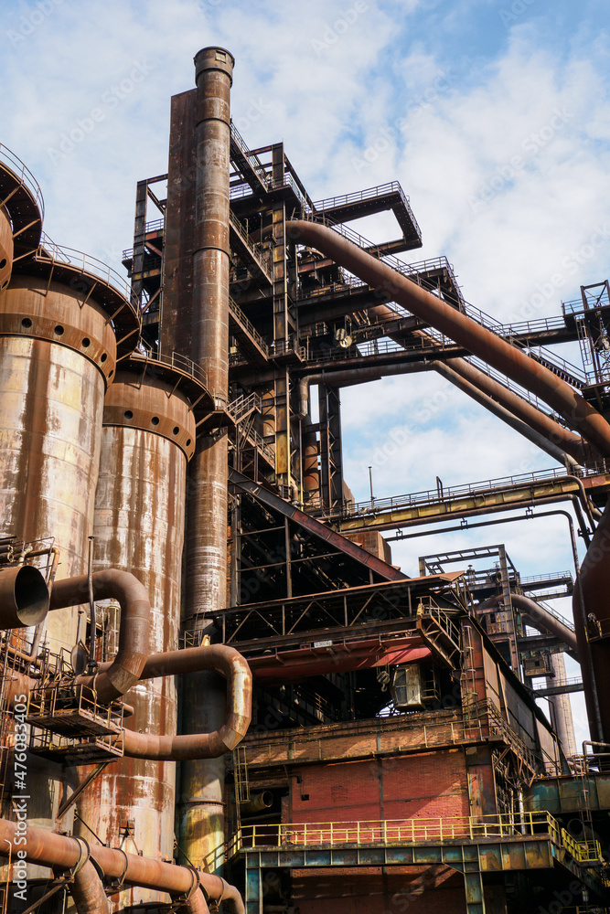 Fototapeta premium Metallurgical rusty tower with pipes.