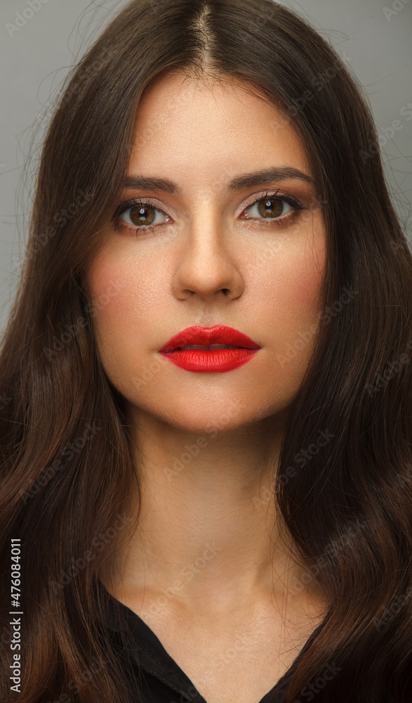 Vertical portrait of young woman with red lips and long hair Vertical portrait of young woman with red lips and long hair