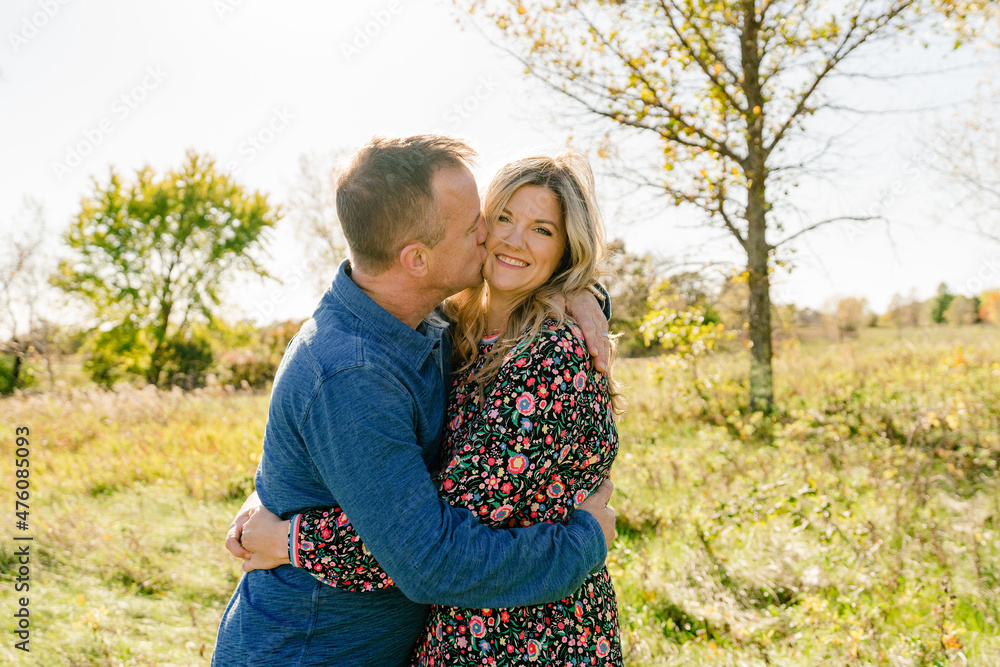 Closeup portrait of a married couple in a grassy field Closeup portrait of a married couple in a grassy field
