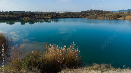 aerial photography from drone, of a lake with blue waters in the middle of nature, autumn