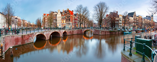 Canvas Panorama of Amsterdam canal Keizersgracht with typical dutch houses and bridge d