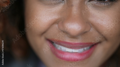 Black woman closing eyes in meditation  person opening eye and smiling at camera